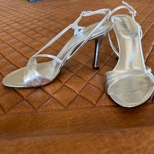 Nine West silver sling back formal shoe. Only worn once. Size 8.